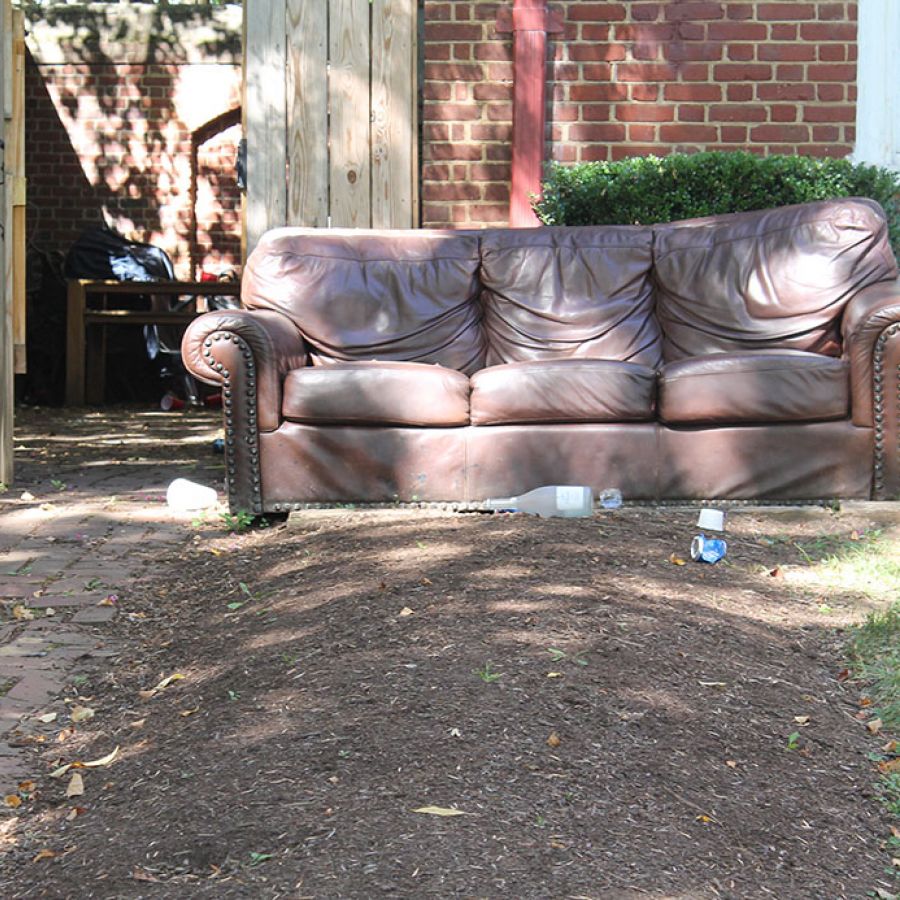 beat-up sofa outside frat house