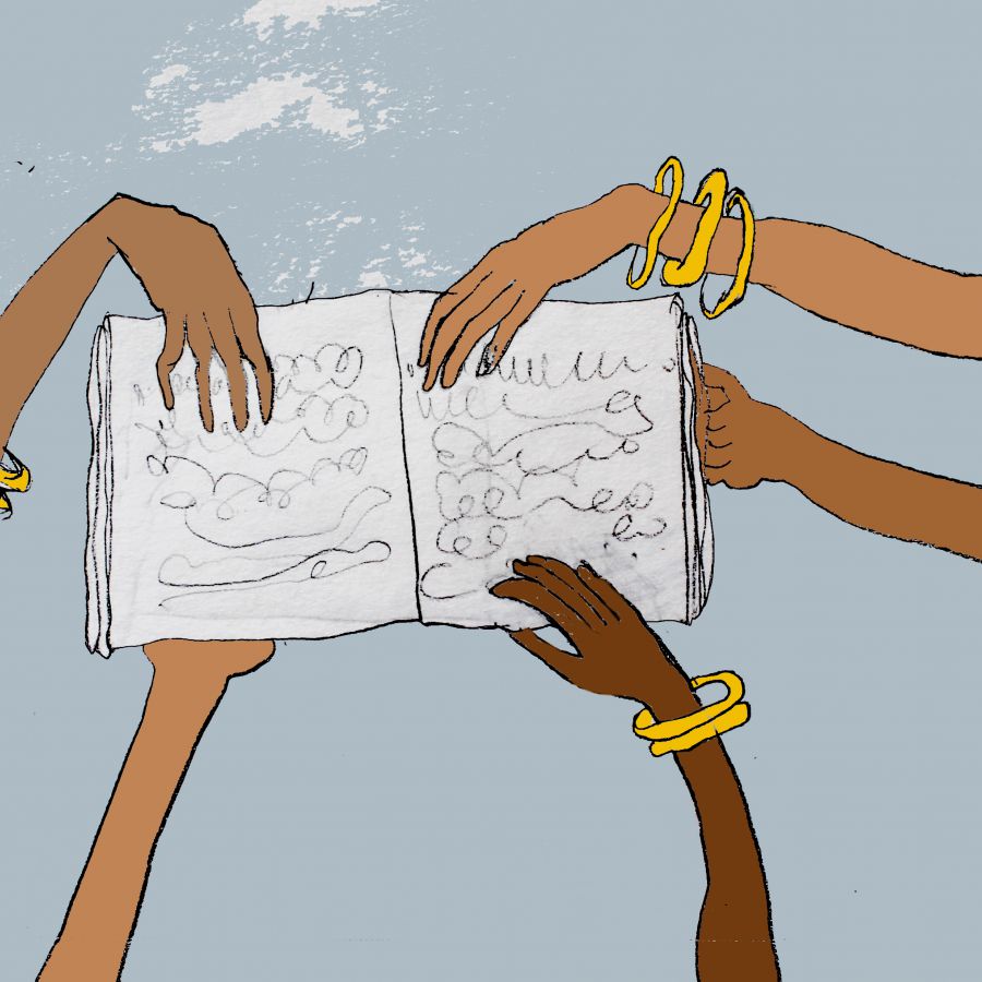 Brown women's hands holding a book