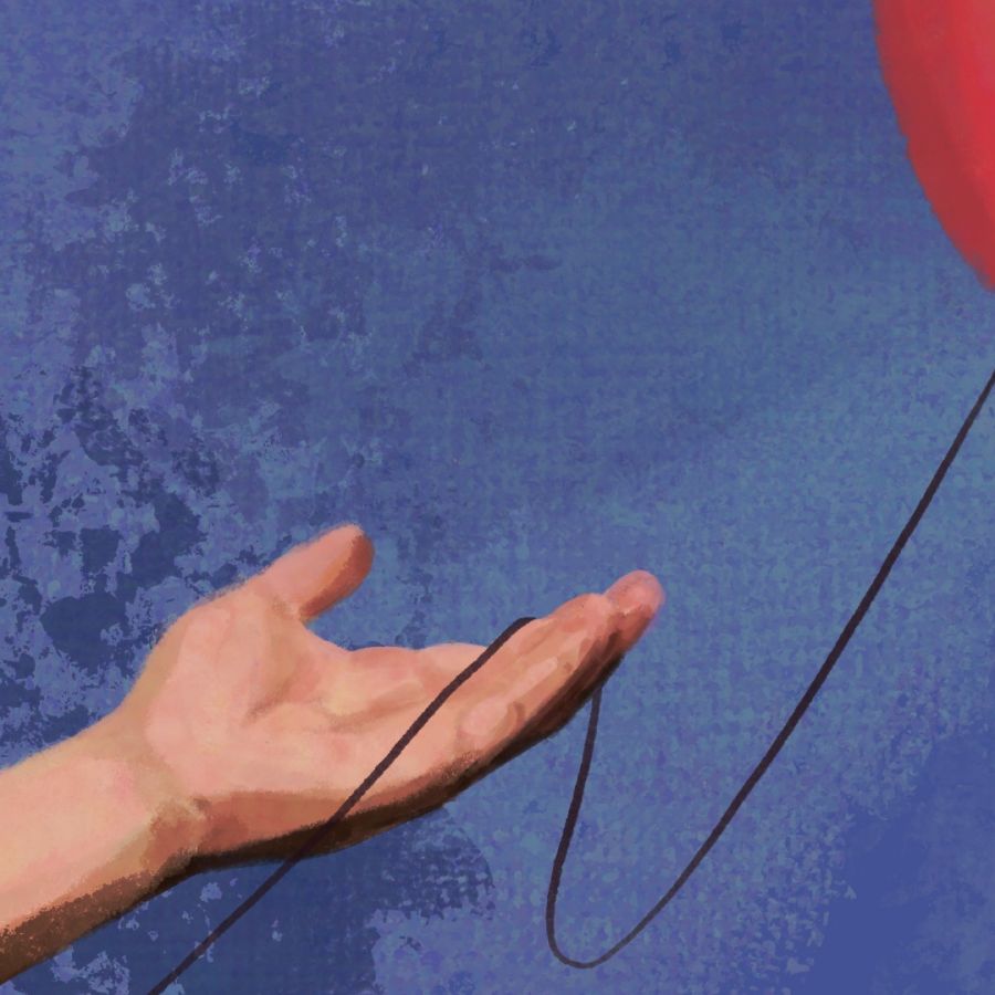 hand extended towards red balloon