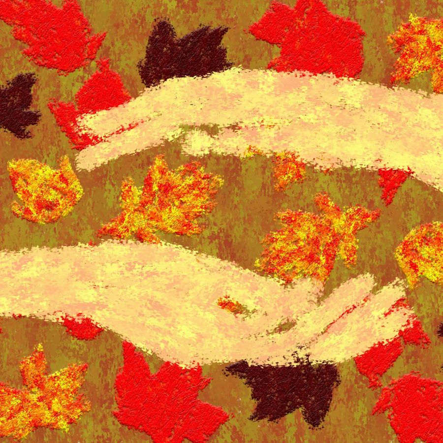 two hands with leaves between and around them in autumnal tones