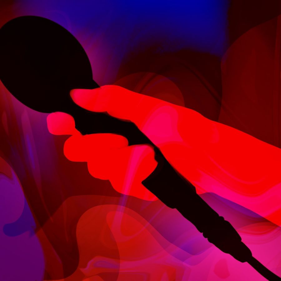 Image of a hand holding a microphone 