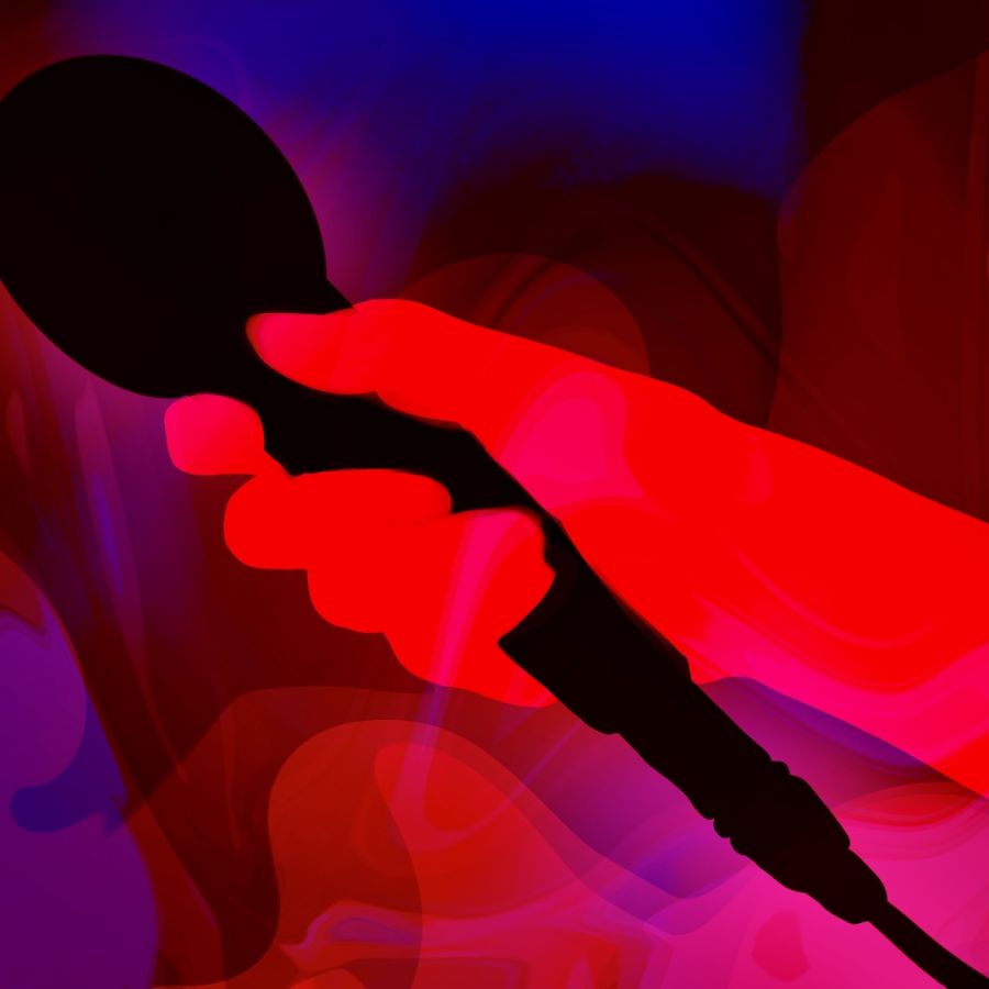 Image of a hand holding a microphone