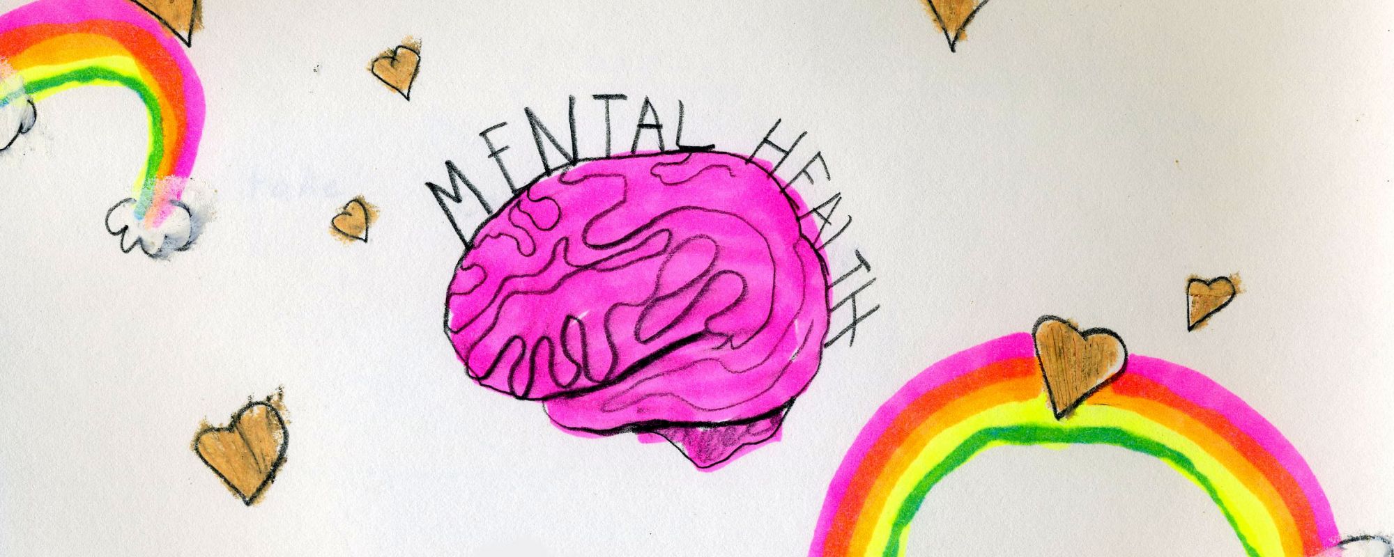 A hand-drawn photo of a brain that says "mental health" on top, with rainbows and hearts around the paper.