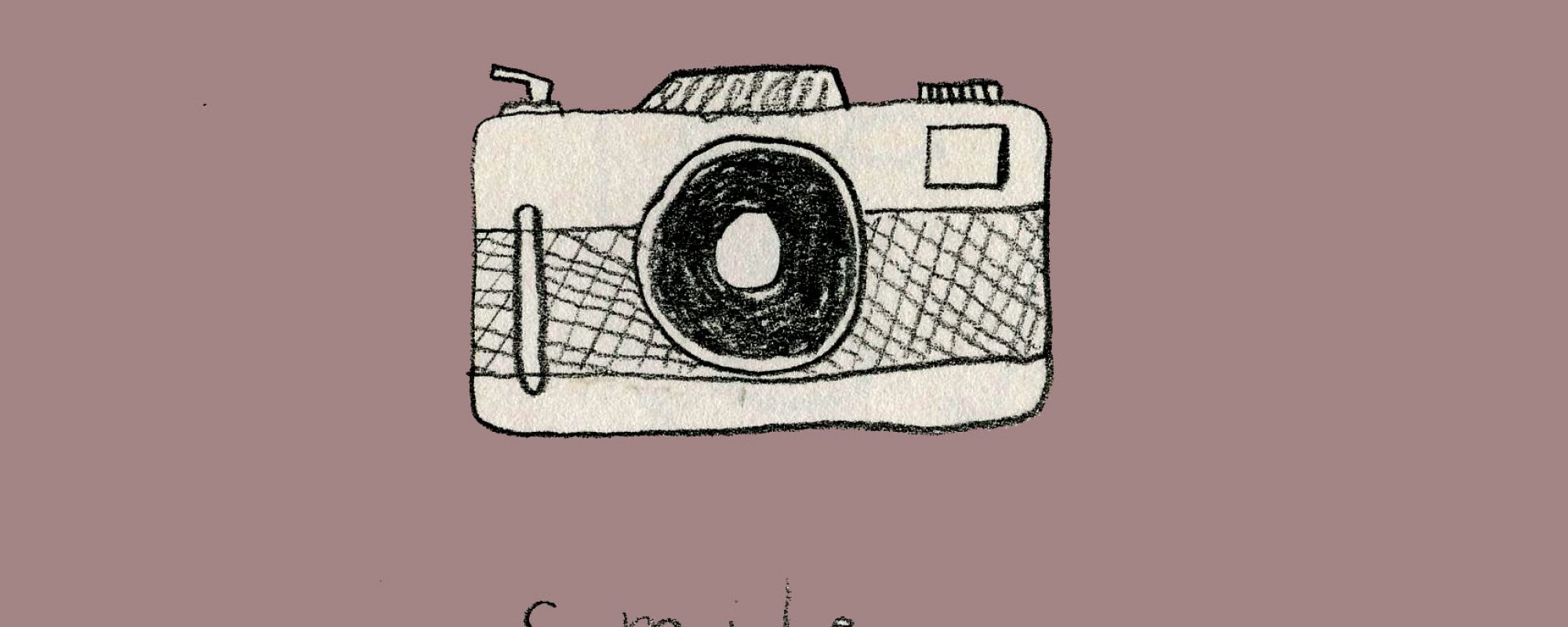 Old camera with a light purple background