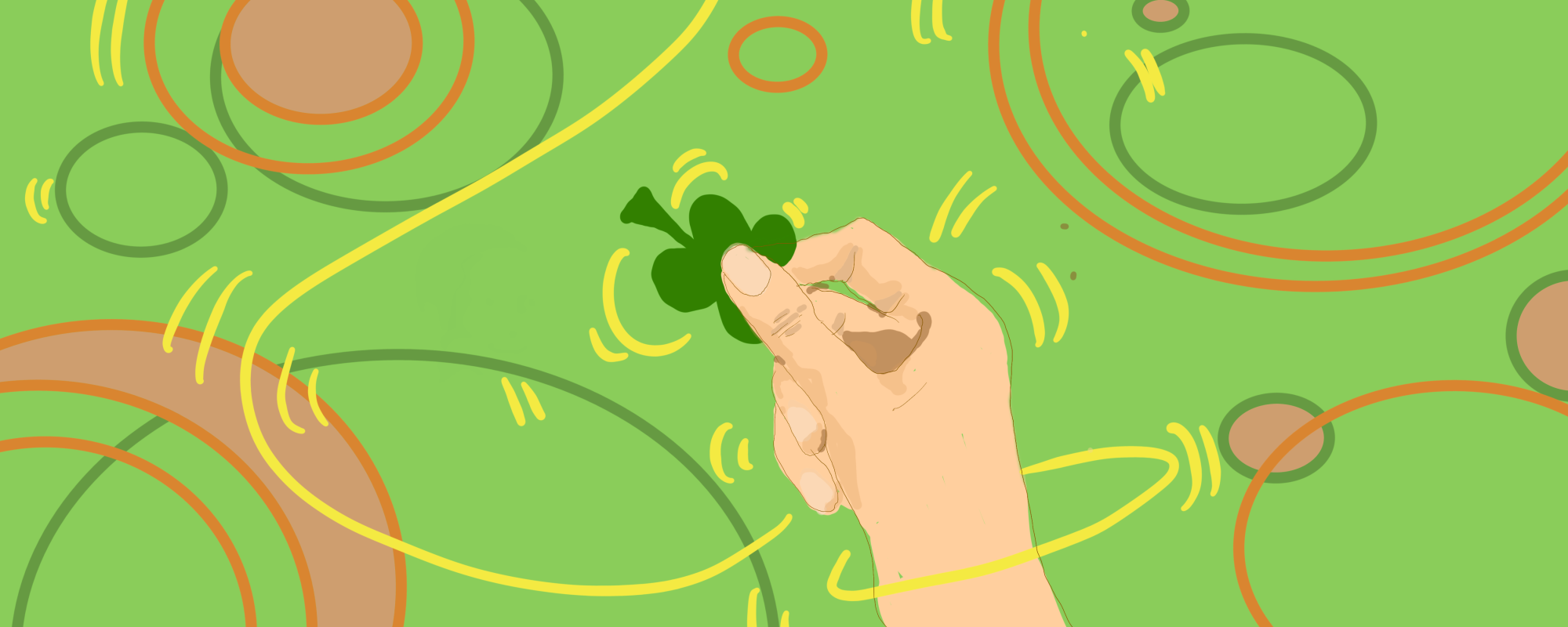 hand holding four leaf clover