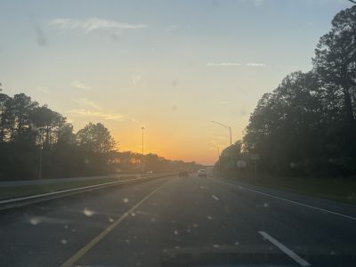 image of sunset taken through windshield