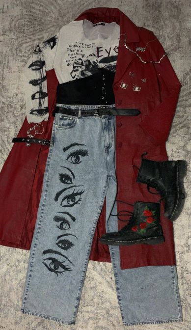 outfit with red over coat, white shirt with black graphics, and jeans with eyes on them and black boots