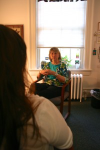 Counseling Services Director, Charlotte Chapman in the middle of a counseling session. Stock photo from the Maxine Platzer Lynn Women’s Center archive